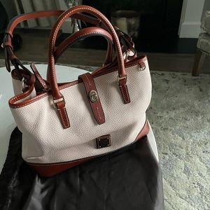Blush color with cognac trim Dooney & Bourke pebble leather “Perry” satchel.